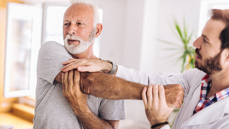 Chiropractor making shoulder adjustment