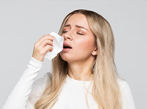 Woman suffering from allergies