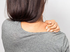 Woman suffering with shoulder pain