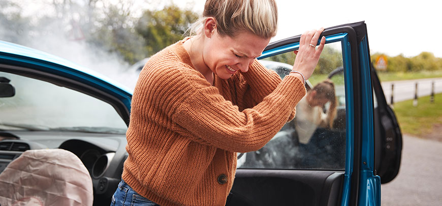 Woman suffering whiplash after an auto accident